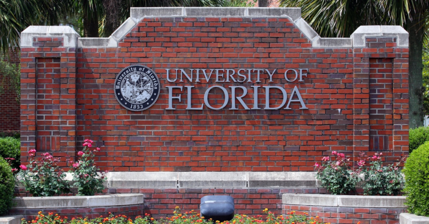 Brick landscaping feature showing the University of Florida name and seal.