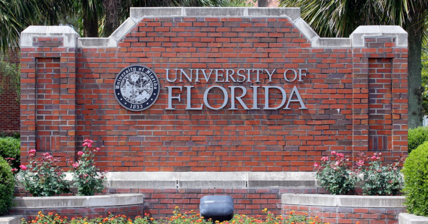 A brick landscaping feature at the University of Florida showing the university's name and seal.
